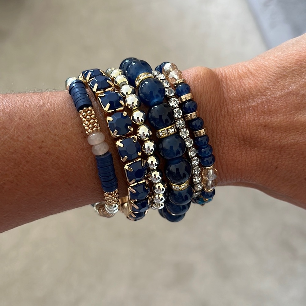 Stacked stretch bracelets.